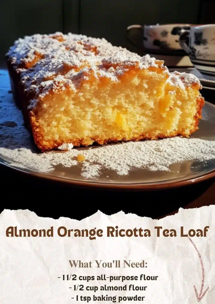 Ricotta Almond Orange Zest Loaf 2 Slice of Ricotta Almond Orange Zest Loaf on a wooden board