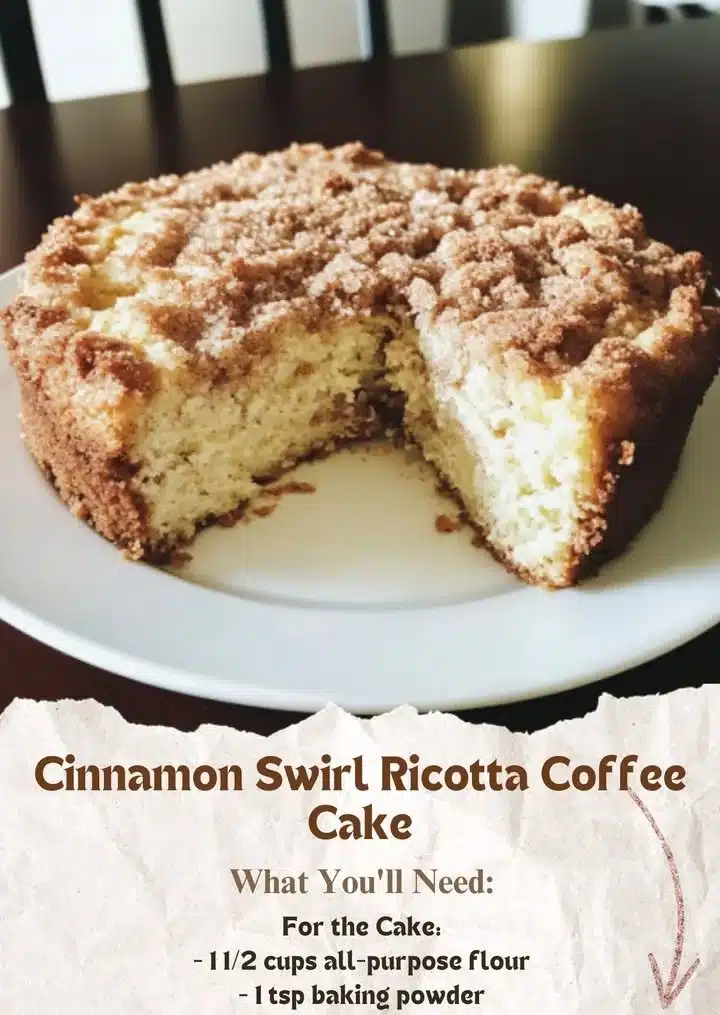 Soft ricotta coffee cake with cinnamon sugar swirl and crumb topping on a plate