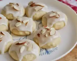 Delicious Ricotta Amaretto Cookies topped with a glaze and almond flavor.