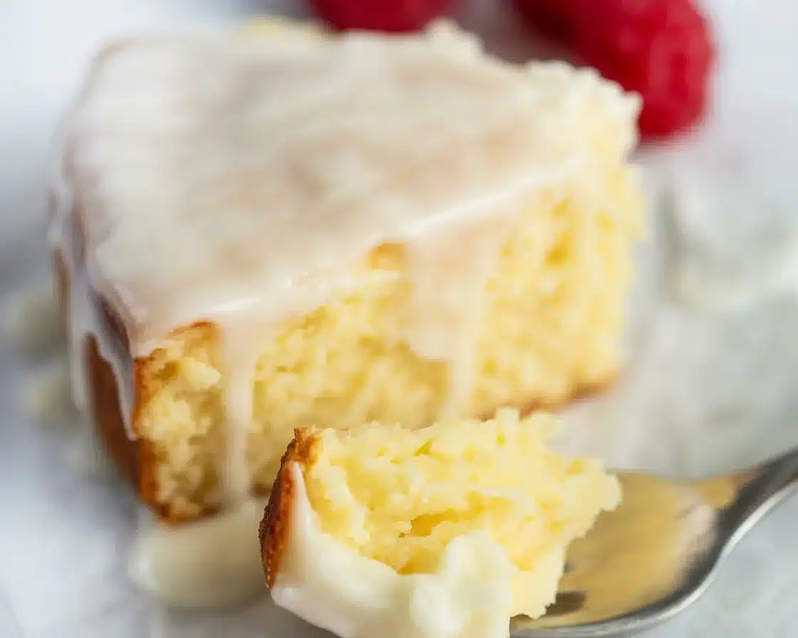 Delicious Almond Lemon Ricotta Cake with a Zesty Lemon Glaze 5 Delicious Almond Lemon Ricotta Cake topped with a sweet lemon glaze and sliced almonds