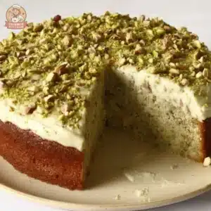 Delicious Nutty Weekend Cake topped with nuts and frosting.