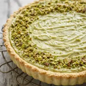 Pistachio Lemon Ricotta Tart with a bright citrus flavor and pistachio topping.
