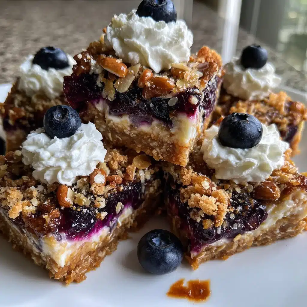 Ginger Blueberry Mascarpone Cookie Bars topped with fresh blueberries and ginger glaze