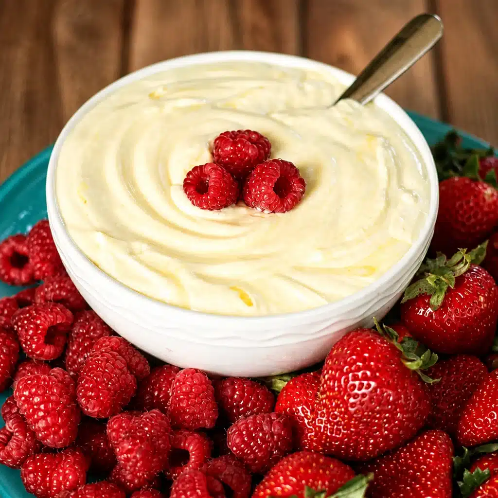 Deliciously Creamy Lemon Pudding Dip for Your Next Dessert Party 4 Creamy Lemon Pudding Dip served with fresh fruit and cookies for a delicious dessert.