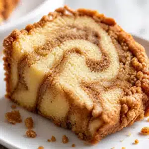 Slice of Easy Cinnamon Swirl Pound Cake Loaf with cinnamon sugar swirl