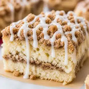 Melt-In-Your-Mouth Bakery Style Cinnamon Crumb Cake with crumb topping.