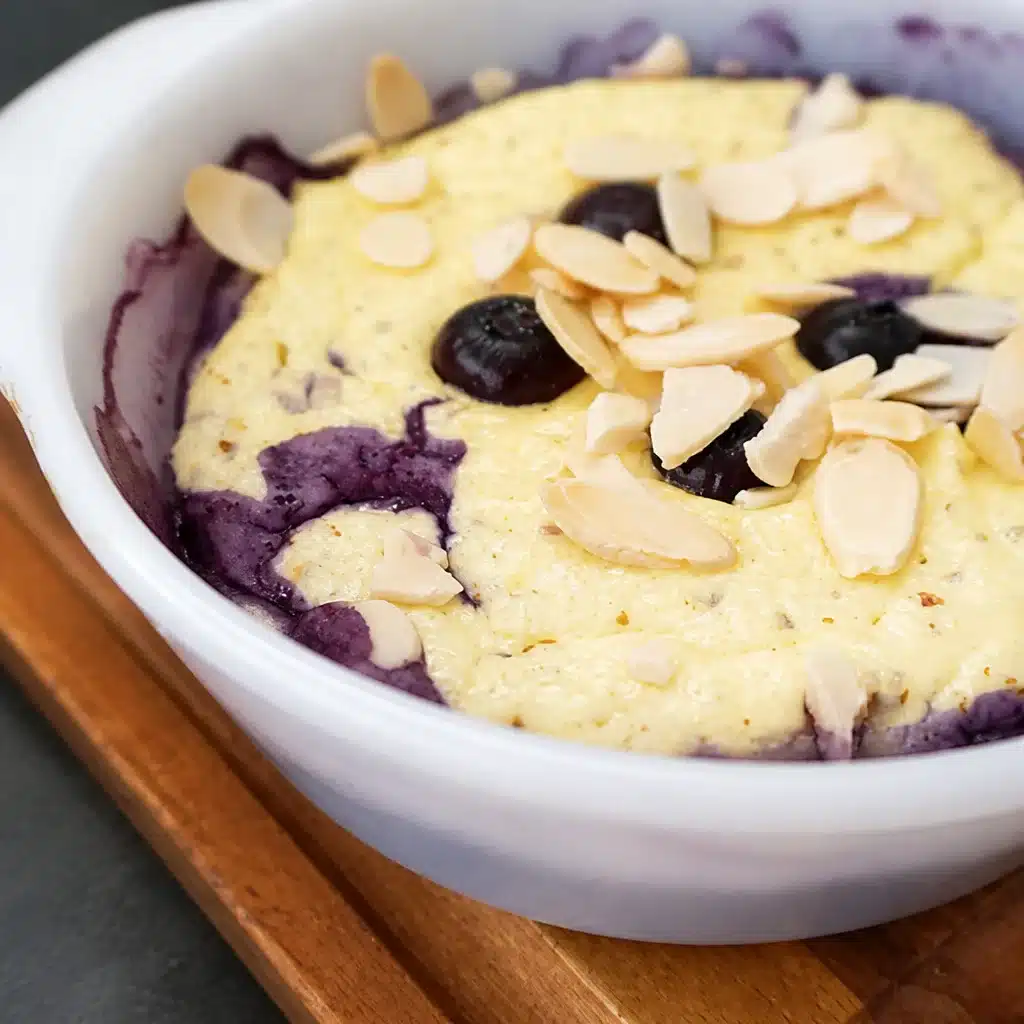Almond Ricotta Breakfast Bake topped with sliced almonds, ready to serve.