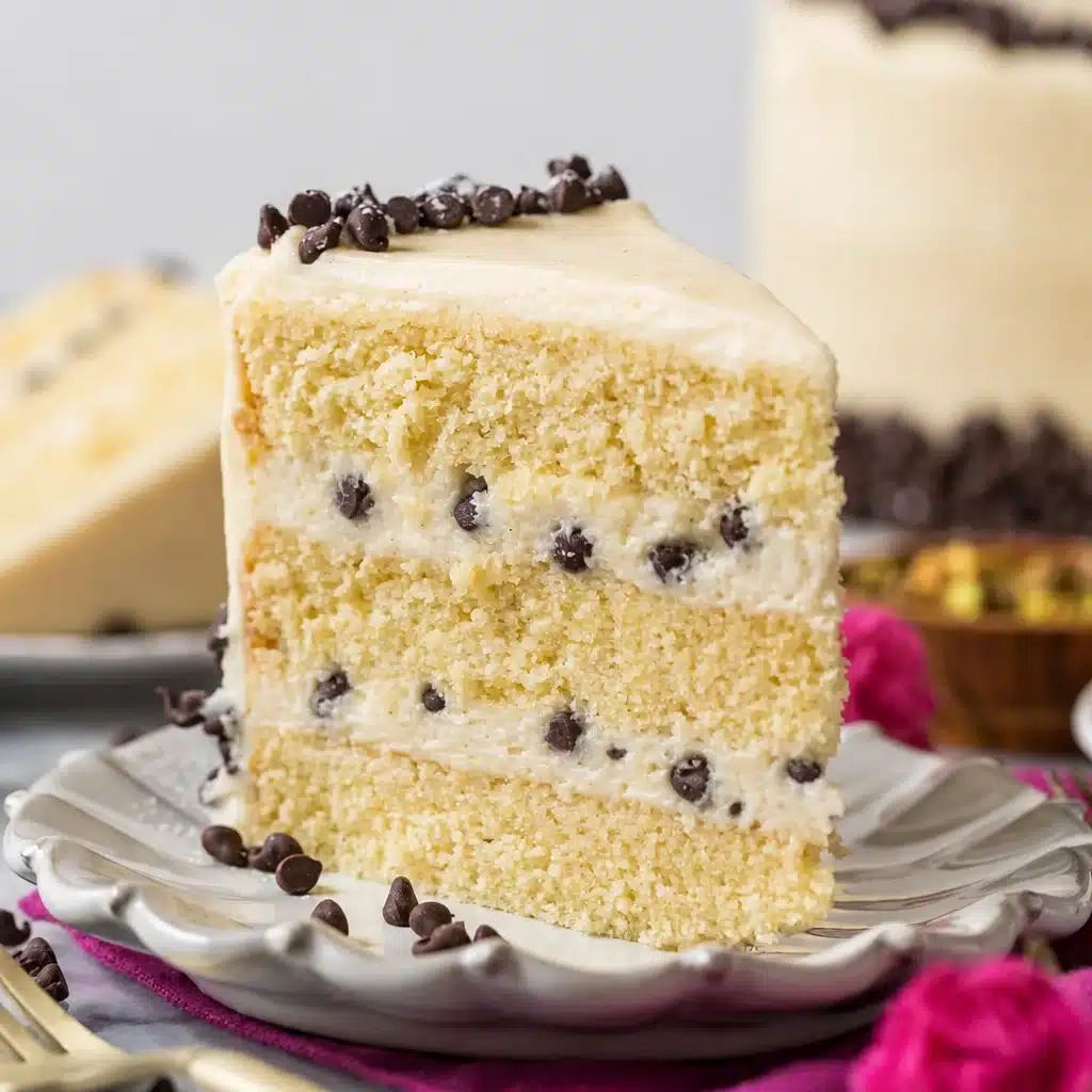 A slice of Creamy Cozy Vanilla Ricotta Cannoli Cake topped with chocolate chips.