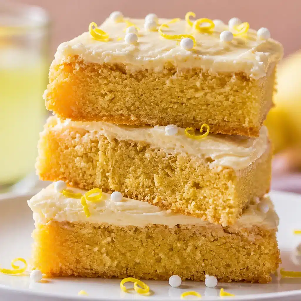 Delicious Limoncello Mascarpone Lemon Bars topped with creamy frosting and lemon zest